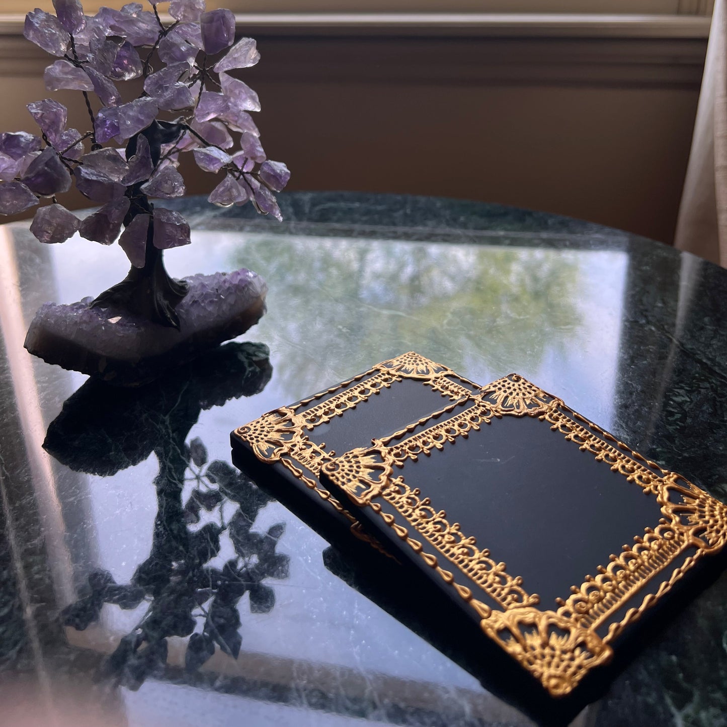 Gold henna ceramic coaster on a coffee table as a set of two, styled for boho home decor
