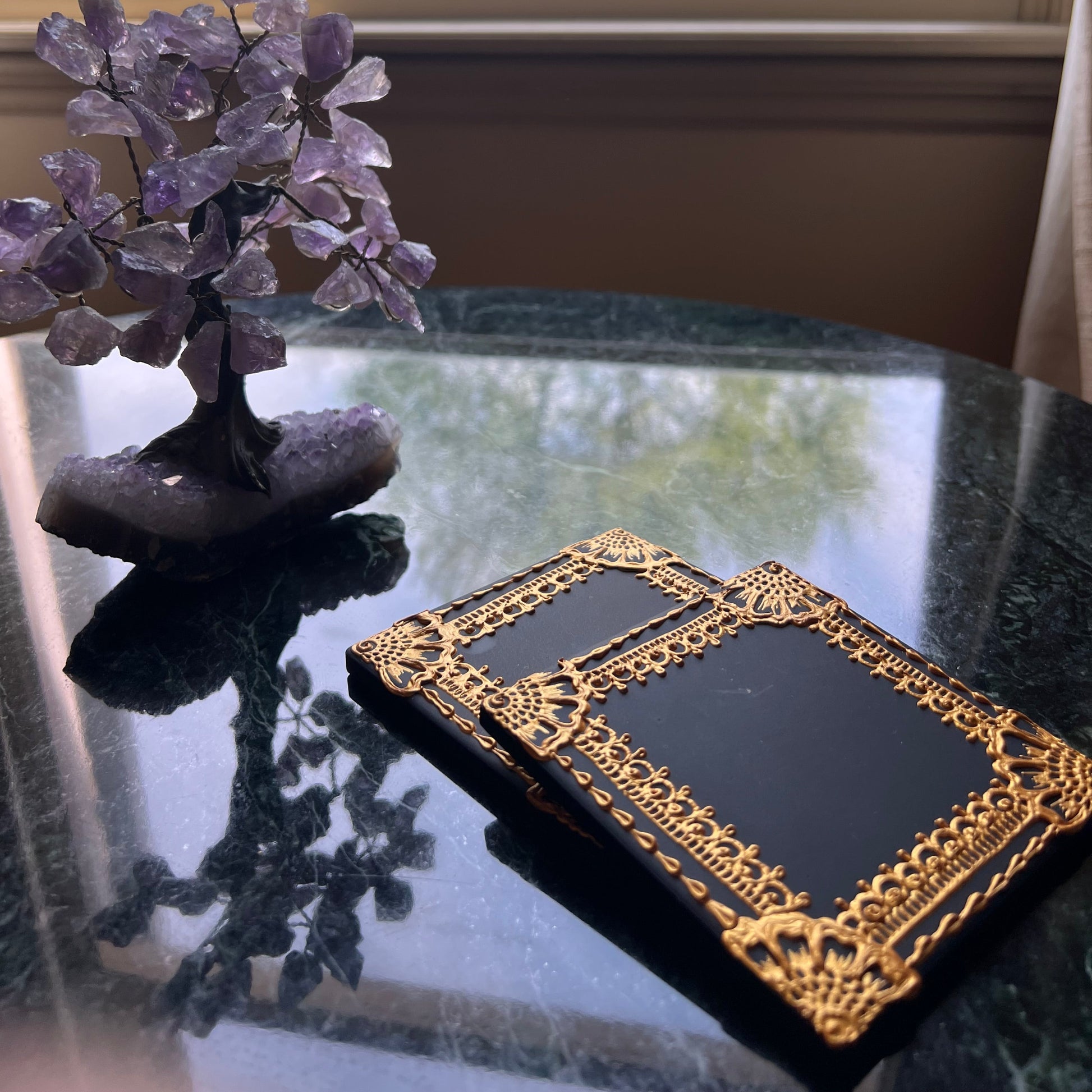 Gold henna ceramic coaster on a coffee table as a set of two, styled for boho home decor